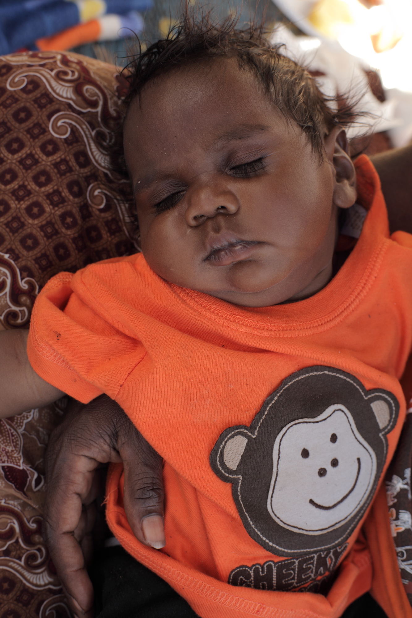 Baby Matthew- tired after the baby smoking ceremony. Yirrkala NT 