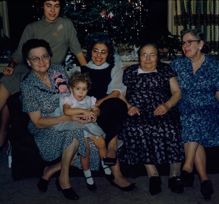 This is me with my mother behind, her mother and grandmother, her father (not pictured) and his mother and grandmother, so both sets of maternal grandmothers and great grandmothers for me.